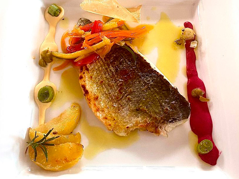Grilled sea bass with vegetables.